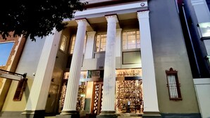 A building with classical architecture, featuring prominent columns and a sign reading "CIRCA 1920". - CIRCA 1928 - Albury  (Albury)