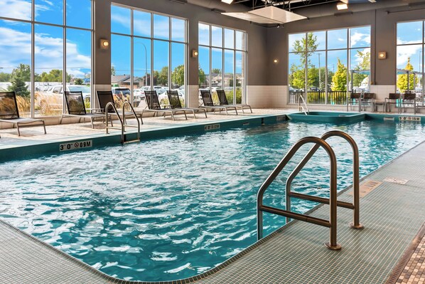 Indoor pool, open 9:00 AM to 10:00 PM, pool loungers