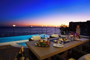 Outdoor pool, open 7:00 AM to 10:00 PM, pool loungers