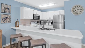 Condo, 2 Bedrooms, Resort View (D205) | Private kitchen | Coffee/tea maker, full-sized fridge, microwave, oven - Peachtree Place By Panhandle Getaways (Panama City Beach)