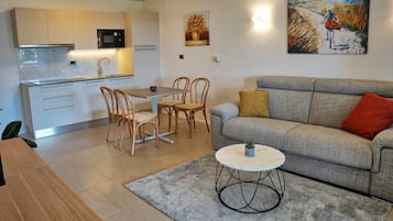 Comfort Apartment, Balcony, Sea View | Living area | Flat-screen TV