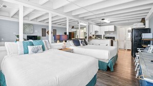 A spacious room with two large beds, a kitchenette, and a bathroom. - Fontainebleau Terrace by Panhandle Getaways (Panama City Beach)