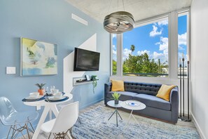 Design Suite, 1 Bedroom (209) | Living area | 49-inch Smart TV with premium channels, TV, Netflix - Design District Suites (Miami)