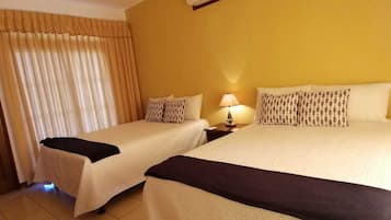 Suite Deluxe | Caja fuerte, wifi gratis, ropa de cama