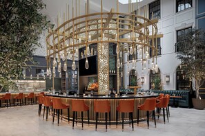 Enjoy drinks and socialize in our circular bar area with ample seating options.