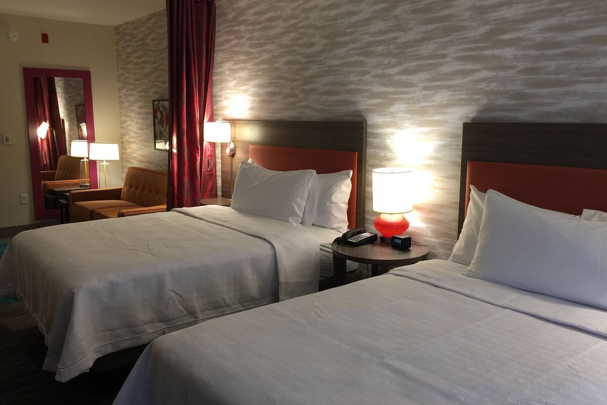 hypo-allergenic bedding, desk, laptop workspace, blackout curtains