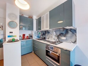 Fridge, oven, high chair, cookware/dishes/utensils