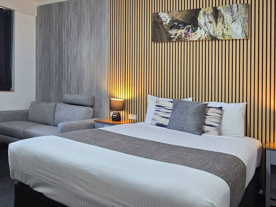 Desk, laptop workspace, blackout curtains, iron/ironing board