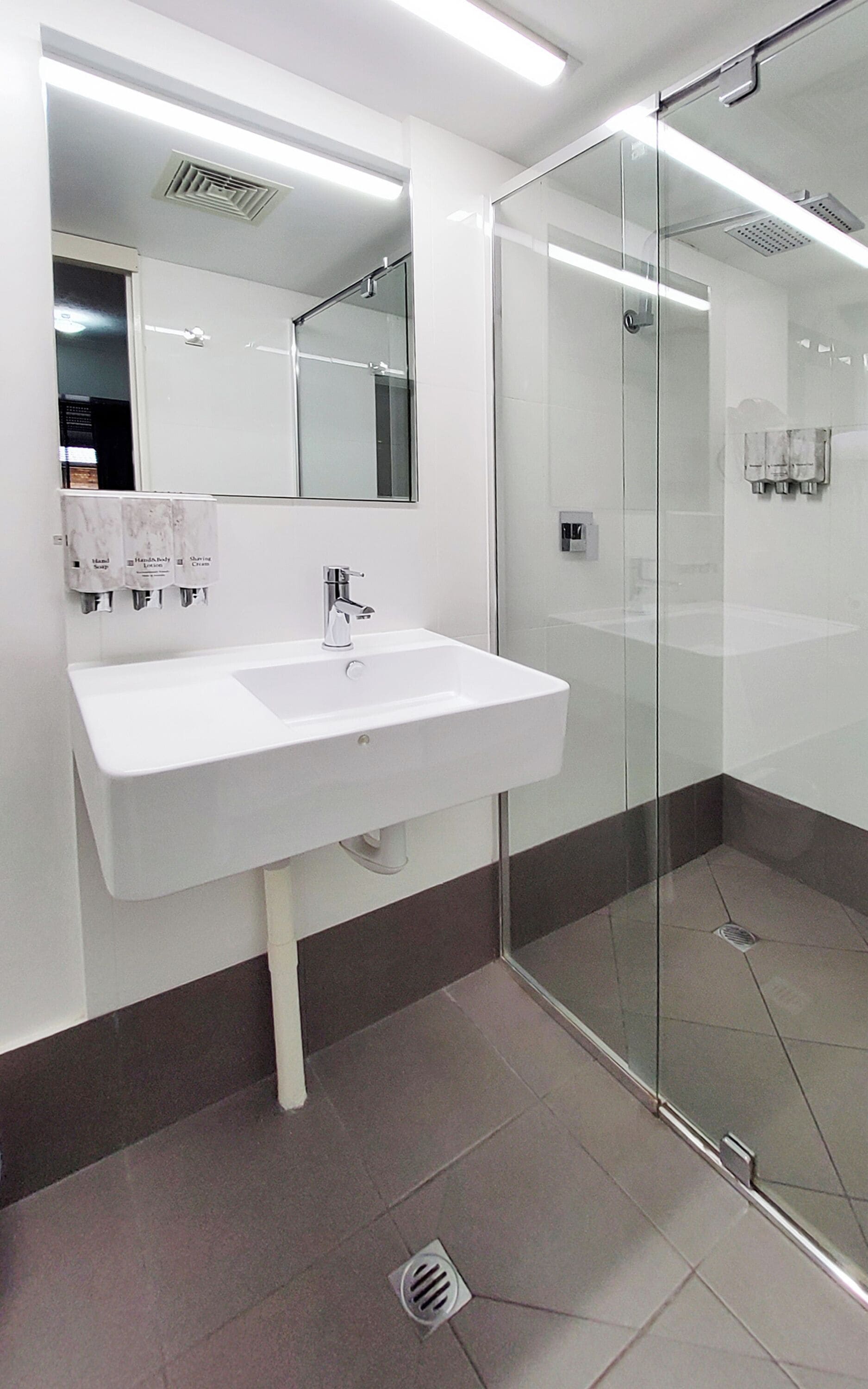 king room (non pet) | bathroom | shower, eco-friendly toiletries, hair dryer, towels