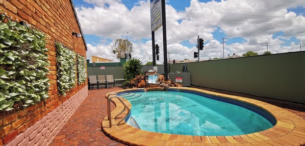 Outdoor pool, open 8:00 AM to 8:00 PM, sun loungers