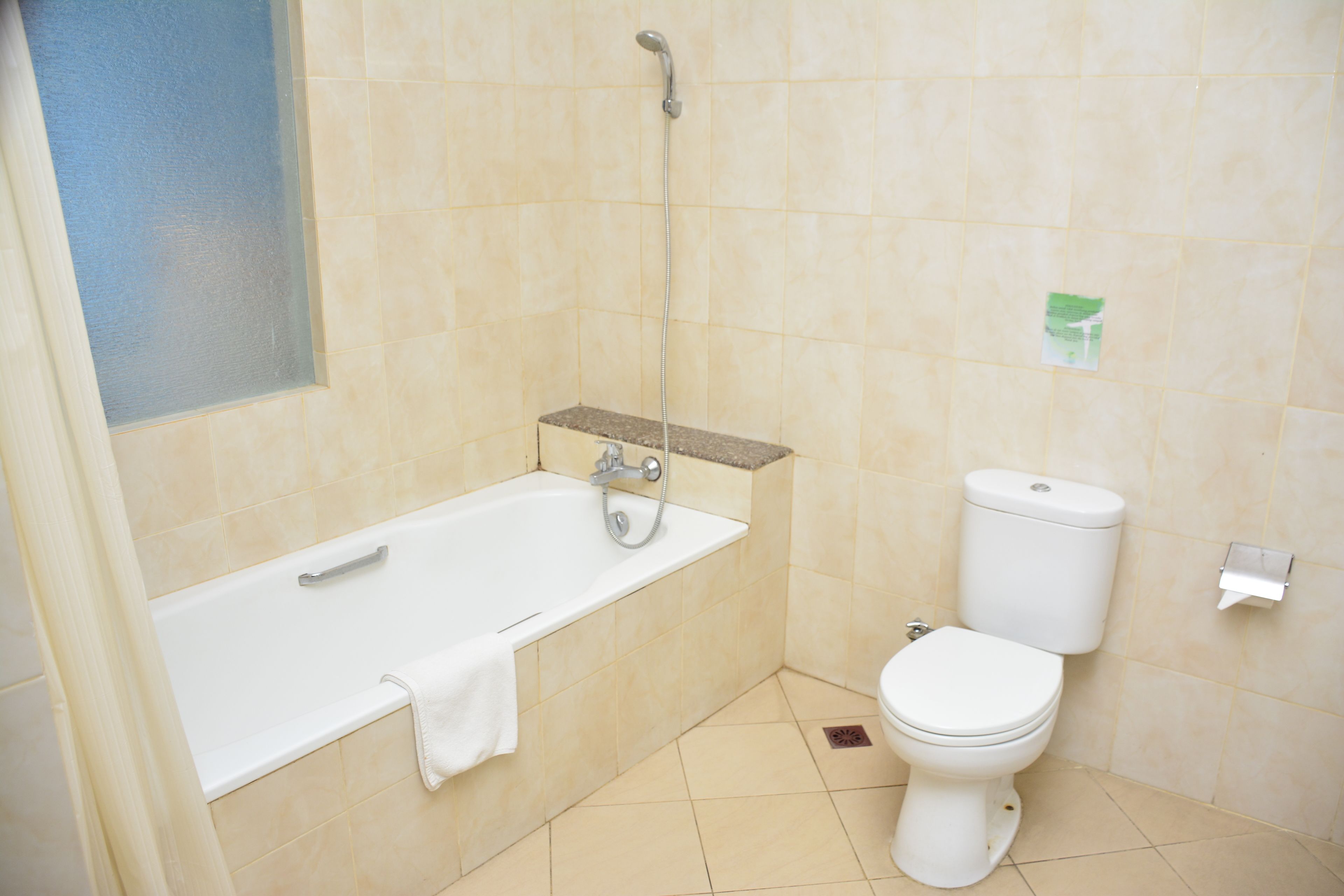 deluxe room | bathroom | shower, towels, soap, shampoo