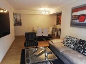Apartamento urbano | Área de estar | TV de tela plana