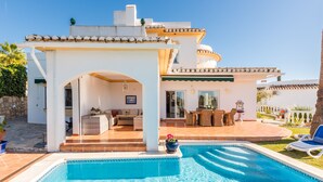 A poolside area with a covered seating area, a pool, and a patio with outdoor furniture. - Villa Panorama – Ocean View Oasis with Private Pool, Mijas Costa (Mijas Costa)