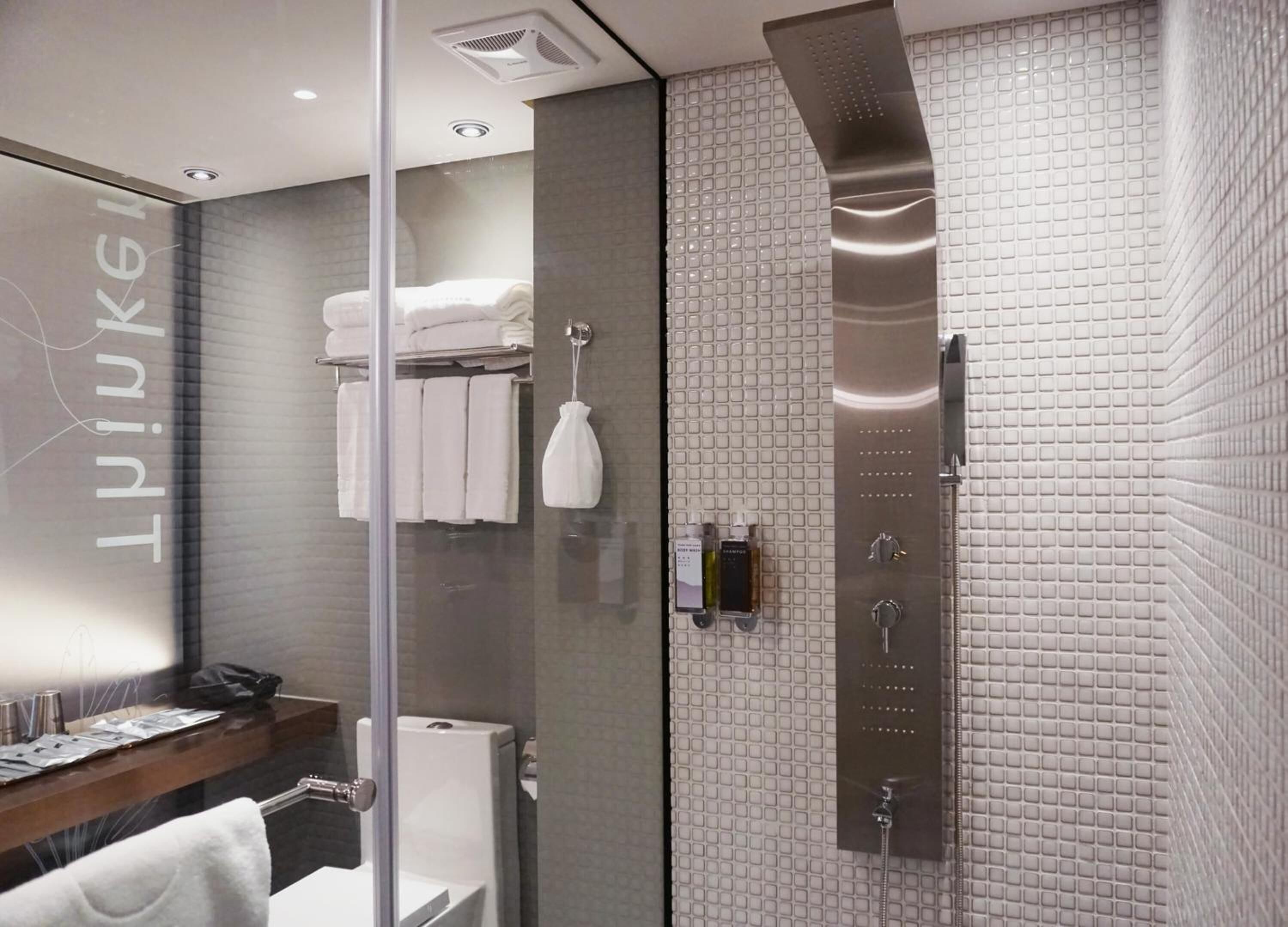 Hair dryer, slippers, towels, shampoo