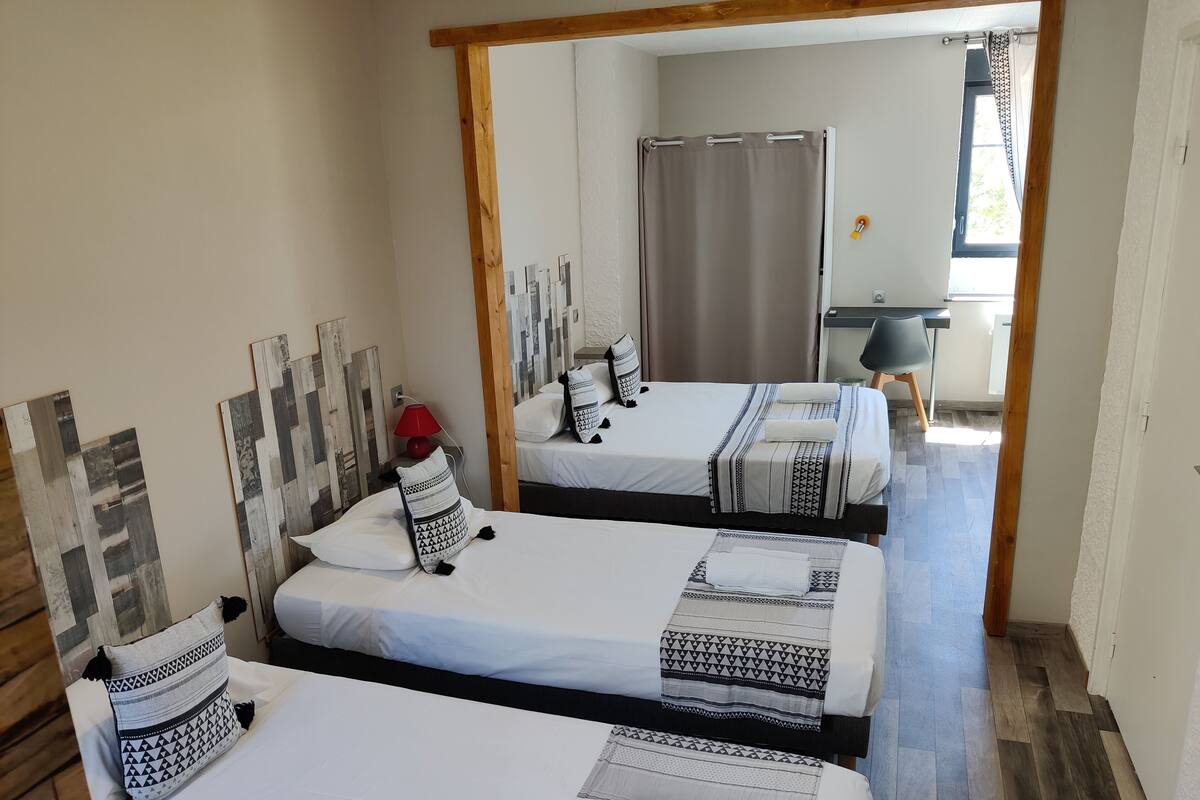 Family Room | Premium bedding, desk, laptop workspace, blackout drapes