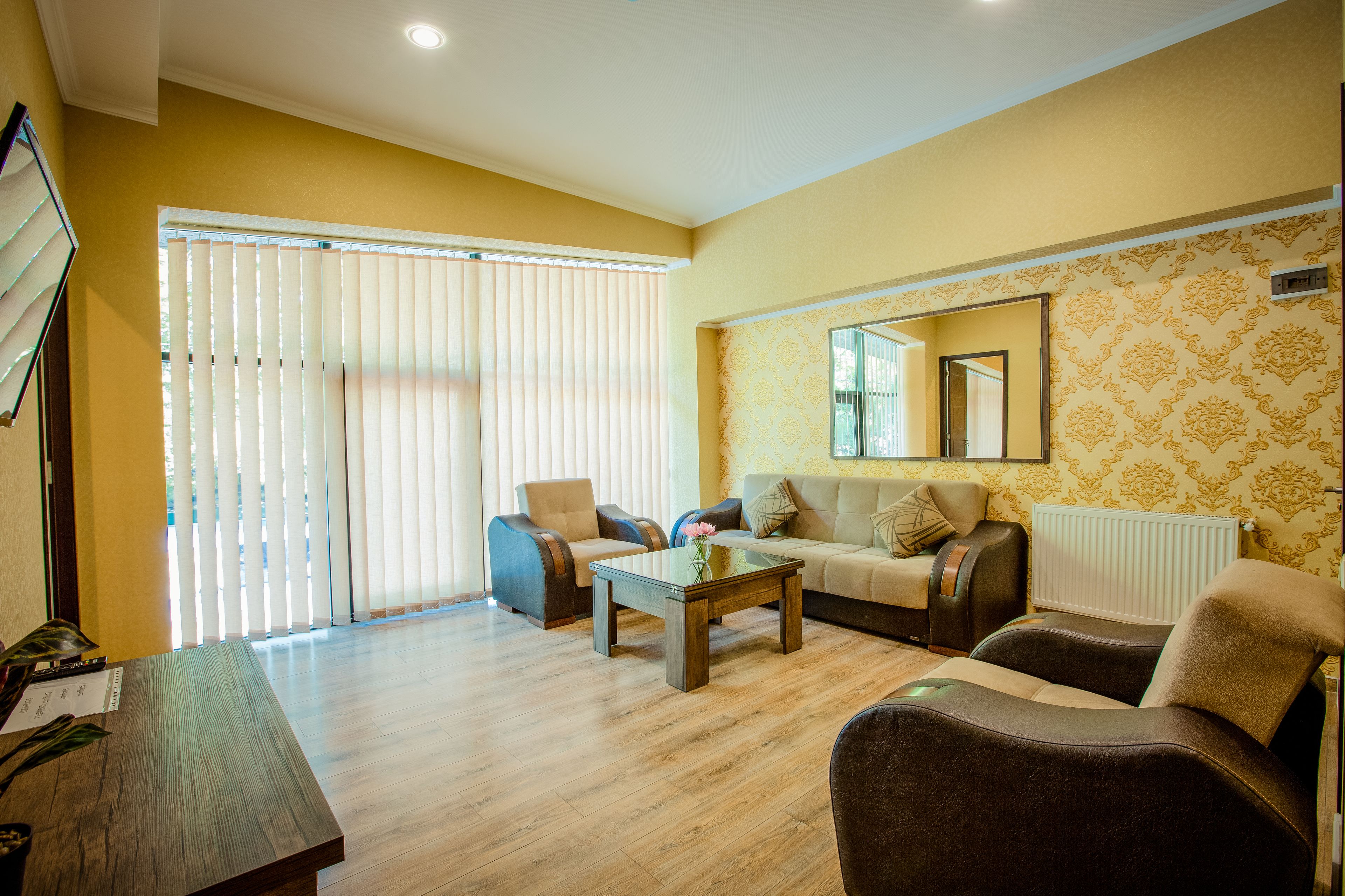 deluxe double room | living room | flat-screen tv