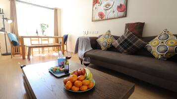 Premier House | Living area | 50-inch flat-screen TV with cable channels, Smart TV, Netflix