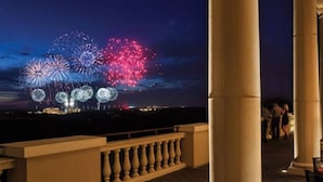 A balcony with a view of fireworks display. - Reunion Resort Townhome - minutes from Disney! (Reunion)