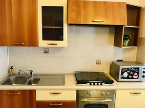 Appartamento, 1 camera da letto | Cucina privata | Frigorifero con congelatore, microonde, forno, piano cottura