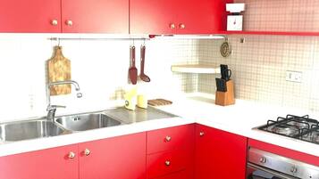 Apartment, 2 Bedrooms | Private kitchen | Full-sized fridge, oven, stovetop, cookware/dishes/utensils