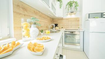 Comfort Apartment | Private kitchen | Full-sized fridge, microwave, dishwasher, coffee/tea maker