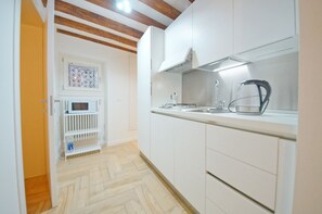 Apartment, 1 Bedroom | Private kitchen | Full-size fridge, microwave, stovetop, coffee/tea maker