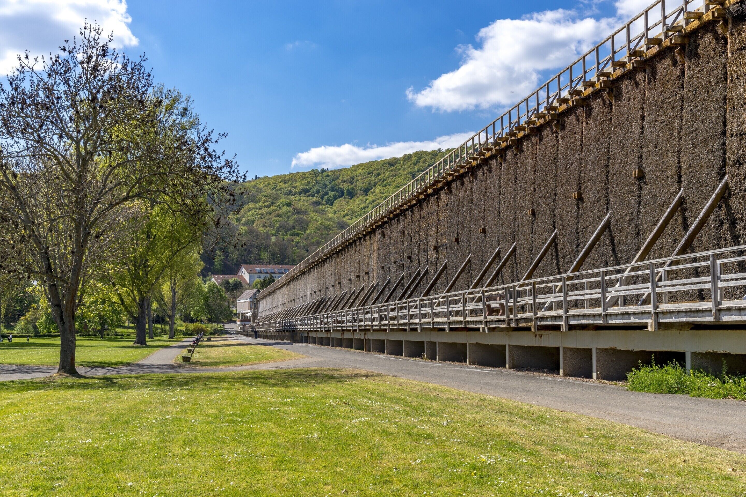 A large, rectangular building with a long, narrow structure and a series of steps leading up to a platform.