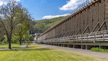 A large, rectangular building with a long, narrow structure and a series of steps leading up to a platform.