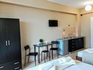 Fridge, stovetop, electric kettle, cookware/dishes/utensils