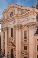 A classical building facade with ornate columns and a central entrance.