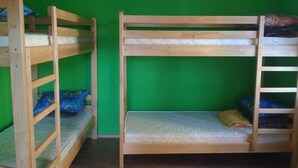 A bunk bed room with green walls and wooden bunk beds. - Yourhostel Saperka (Kyiv)