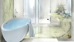 A modern bathroom with a freestanding bathtub, a glass-enclosed shower, and a marble countertop. - Vista Palazzo, Lago di Como (Como)
