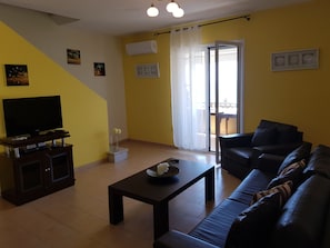 Apartment, 2 Bedrooms | Living area | Flat-screen TV