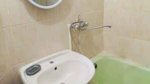 Bathtub, towels, toilet paper