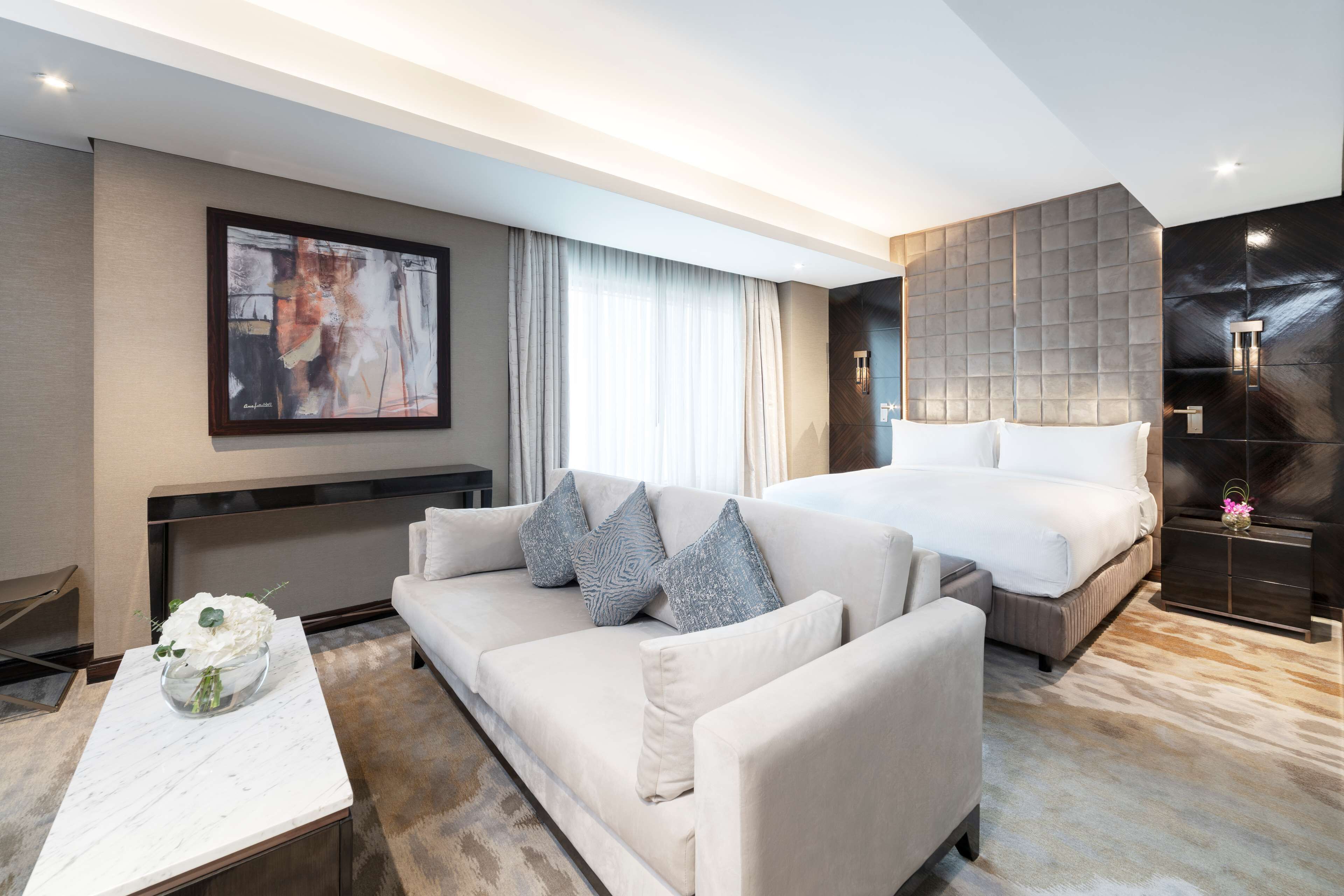 king ambassador suite, suite | living area | 55-inch flat-screen tv with cable channels, tv