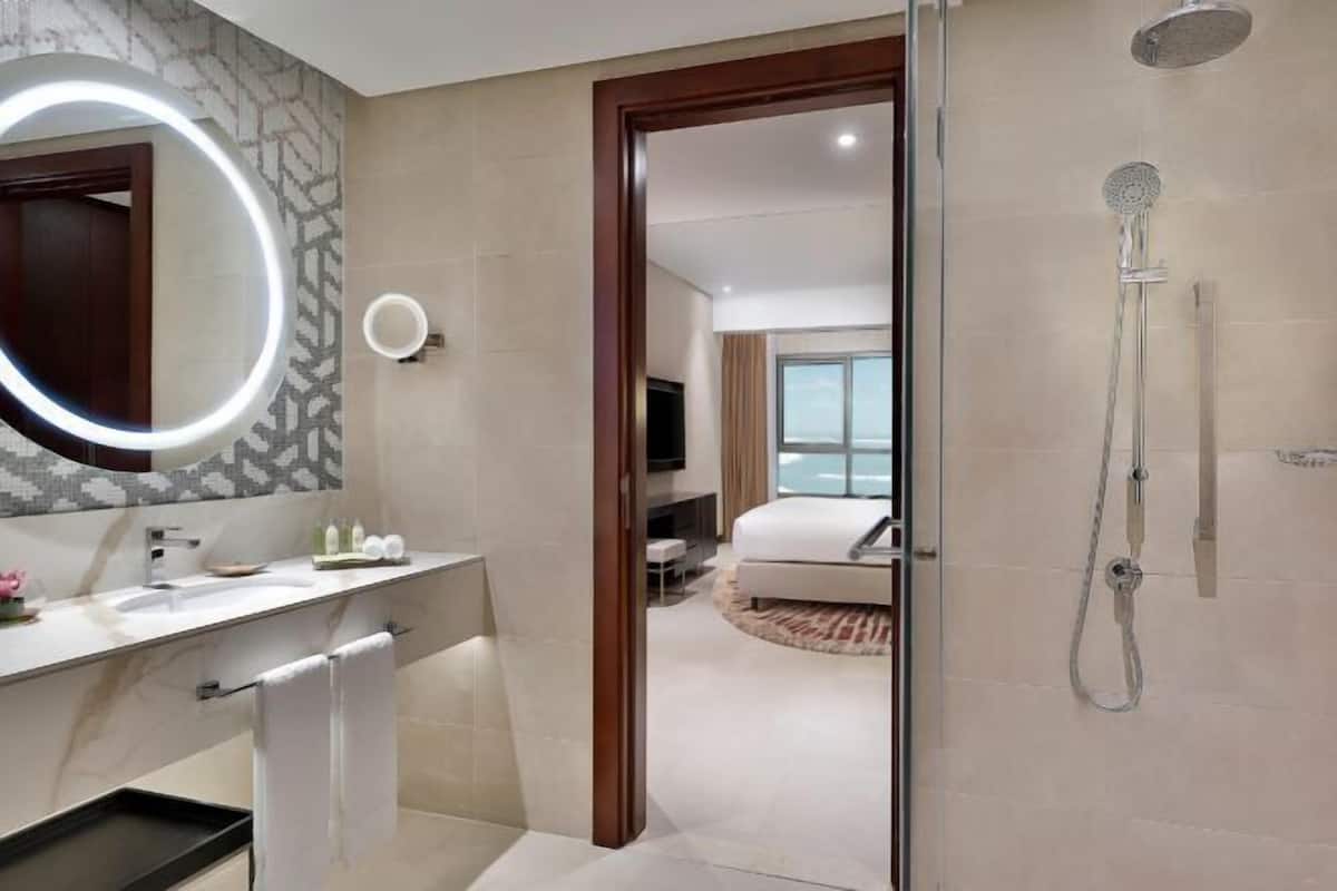 Separate bathtub and shower, designer toiletries, hair dryer, bathrobes