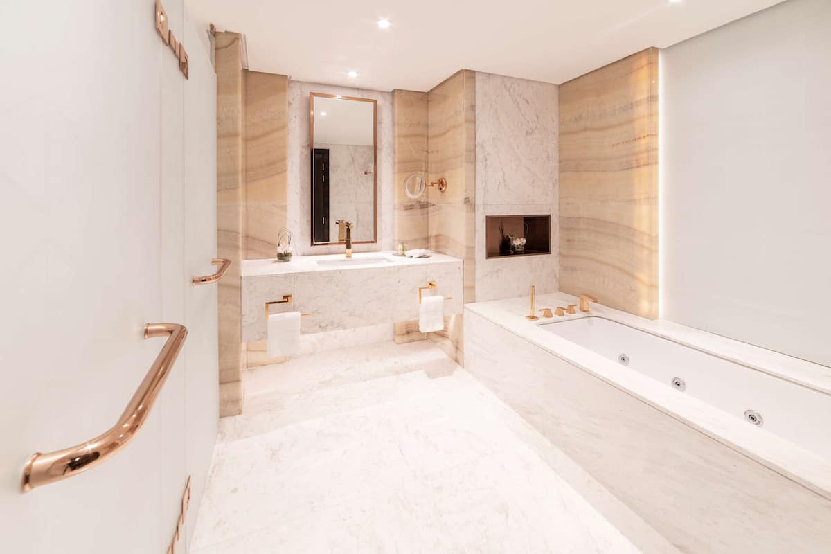 presidential suite, 1 king bed | bathroom | separate bathtub and shower, designer toiletries, hair dryer, bathrobes