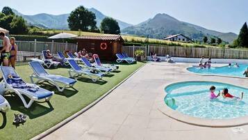 Seasonal outdoor pool, open 10:00 AM to 8:00 PM, pool umbrellas