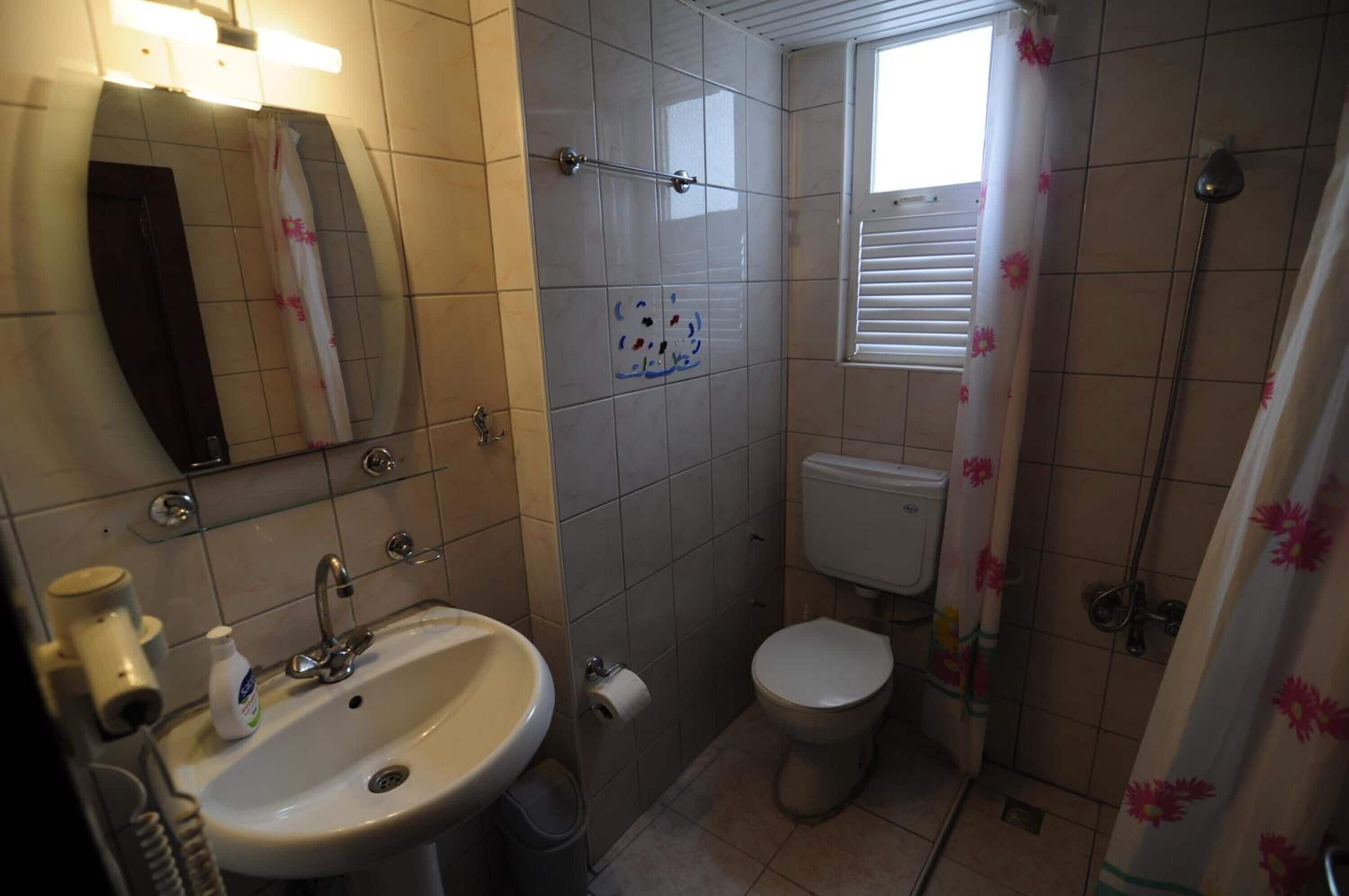 shower, rainfall showerhead, hair dryer, towels