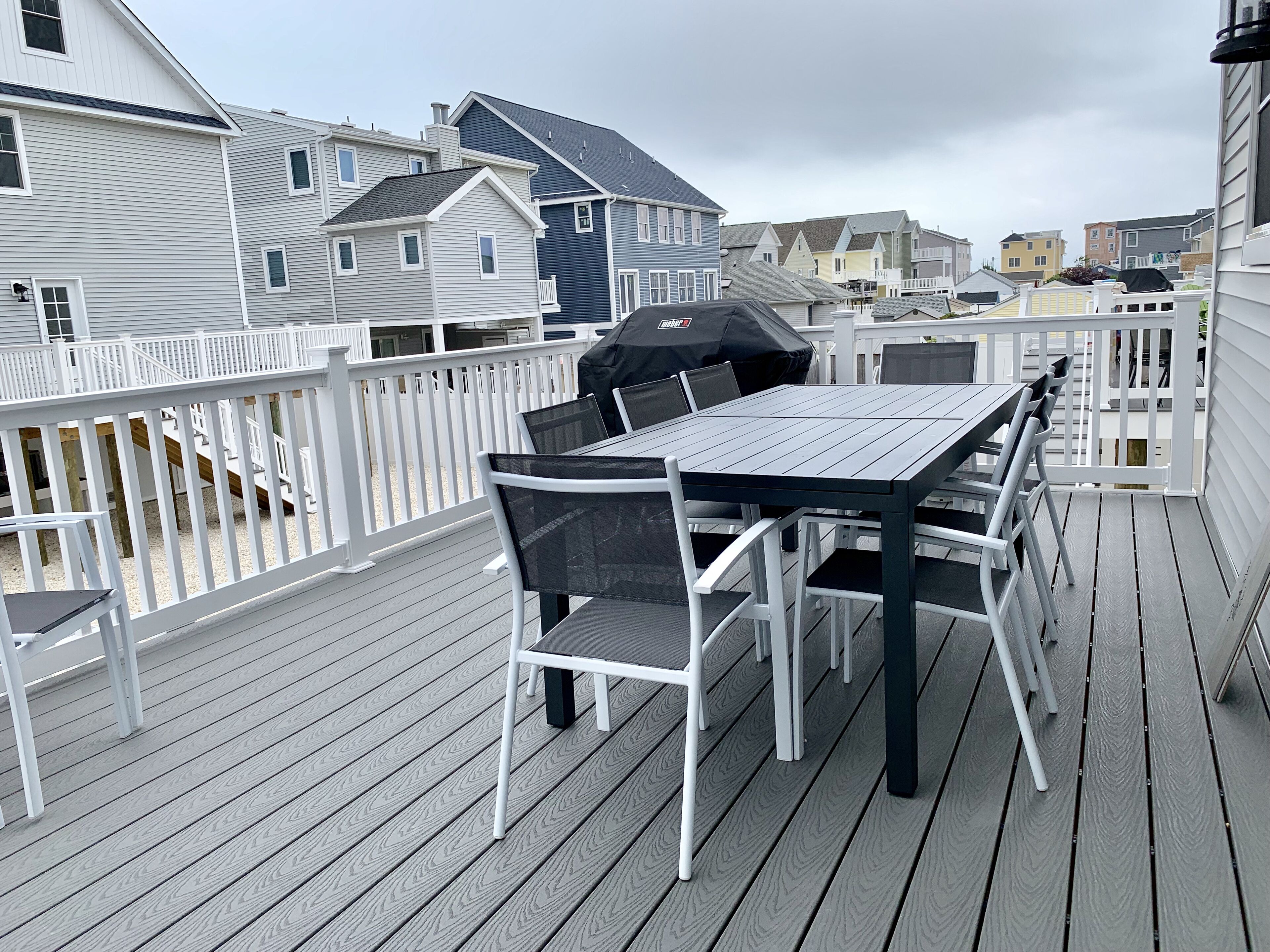 10 person extendable outdoor table on deck with Weber grill 
