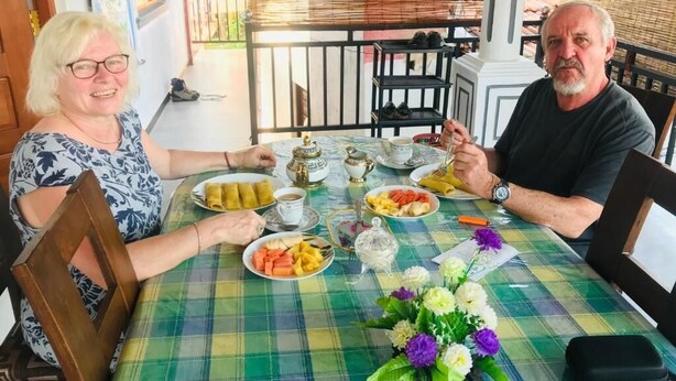 A dining table with plates of food, cups, and a teapot. - Rodrigo's Villa & Restaurant (Negombo)