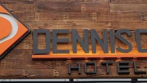 A wooden sign with the text "DENNIS HOTEL" indicating the name of the establishment. - The Dennison Hotel (Angeles City)