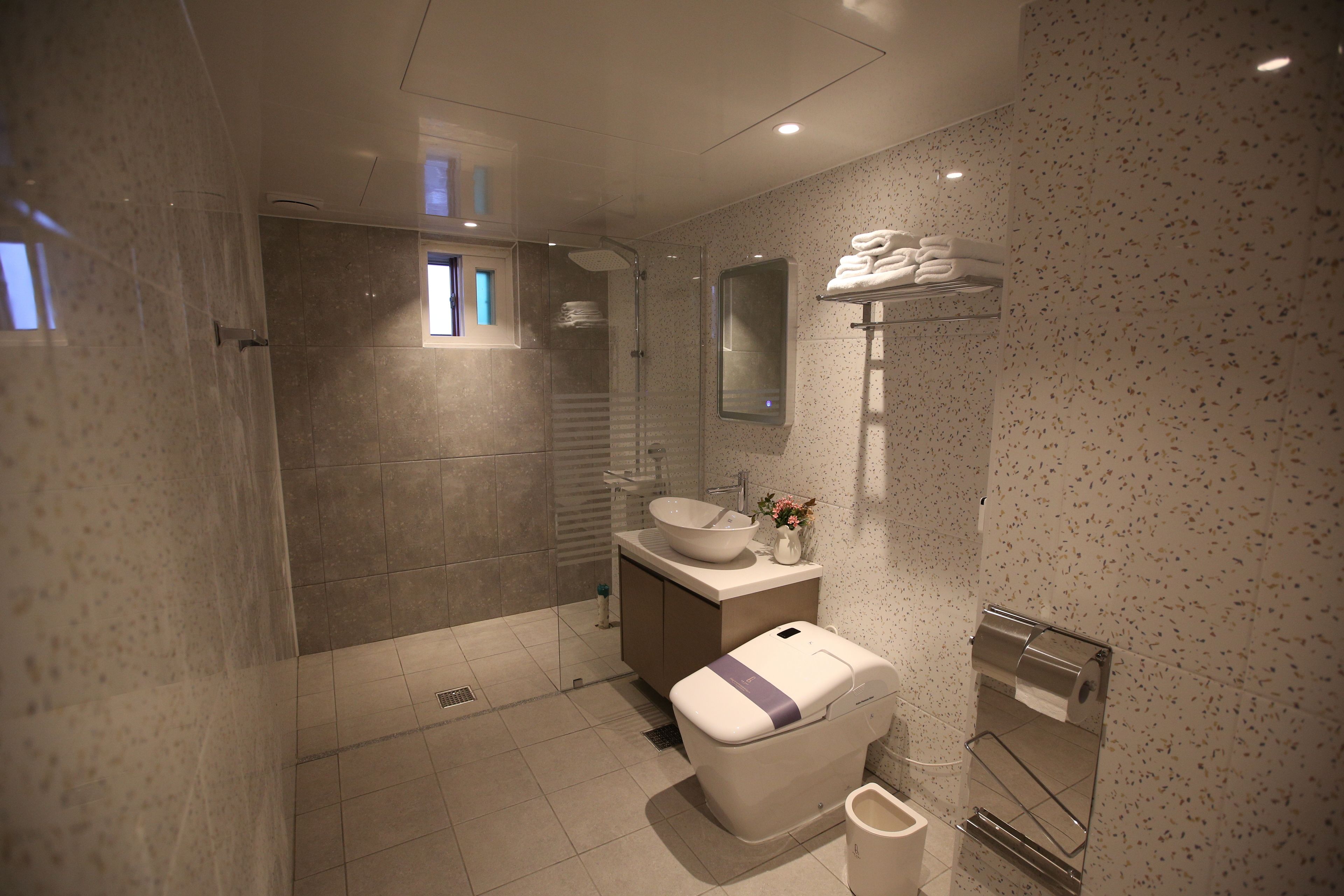 family suite | bathroom | shower, hair dryer, towels, soap