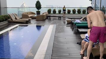 Outdoor pool, open 10:00 AM to 10:00 PM, pool loungers