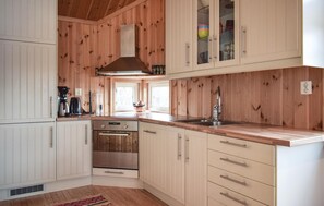 Fridge, stovetop, dishwasher, coffee/tea maker