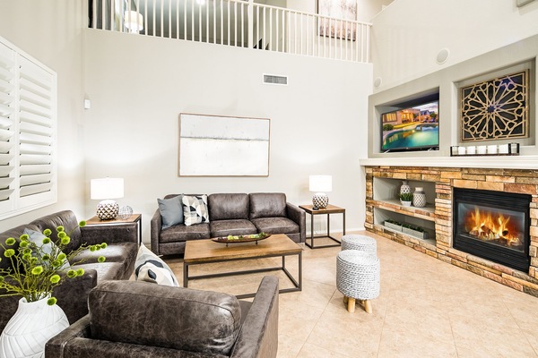 Open concept floor plan with cozy fireplace.