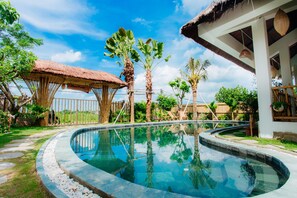 Outdoor pool, pool umbrellas, sun loungers