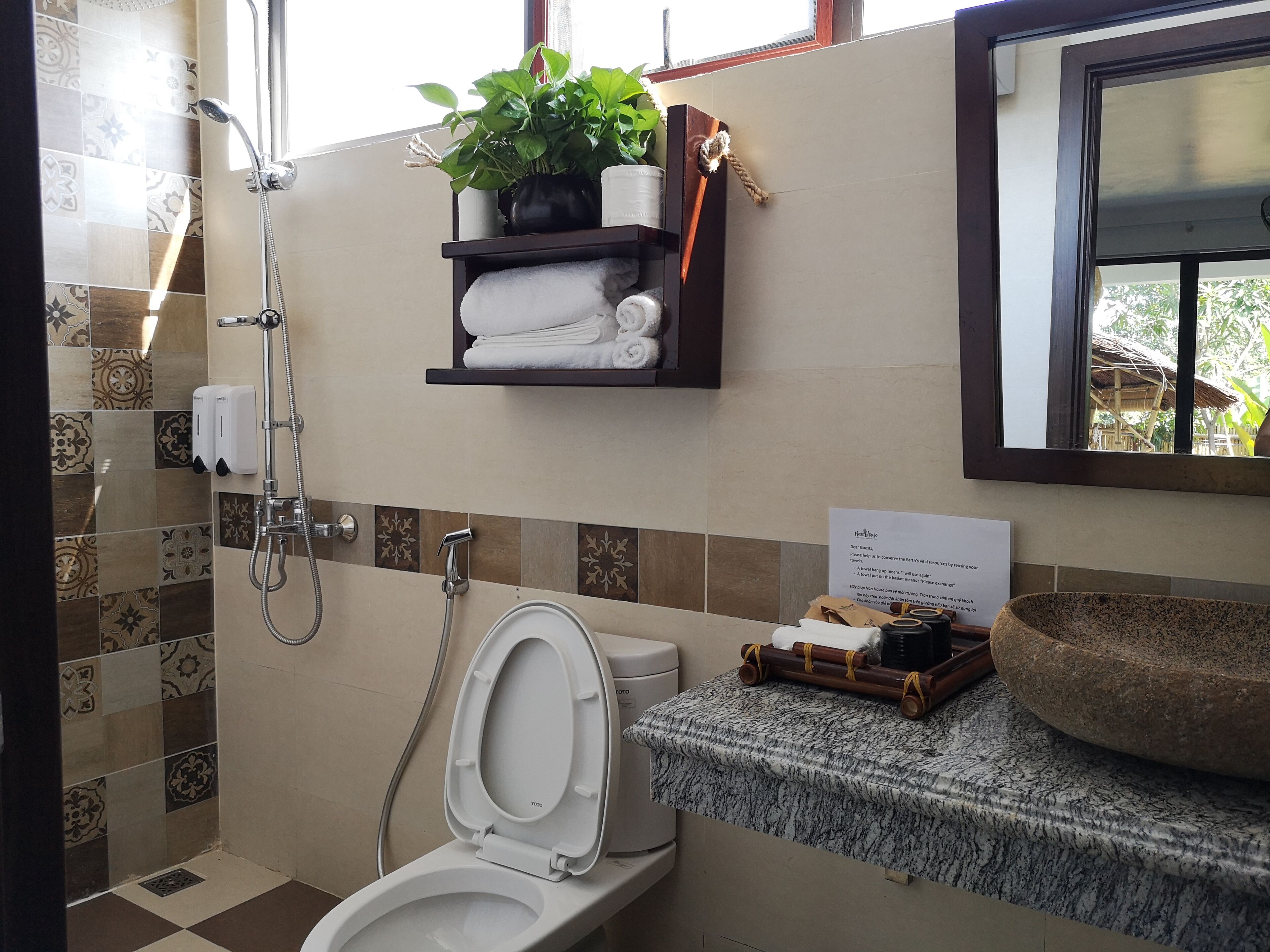 deep-soaking bathtub, rainfall showerhead, hair dryer, bathrobes