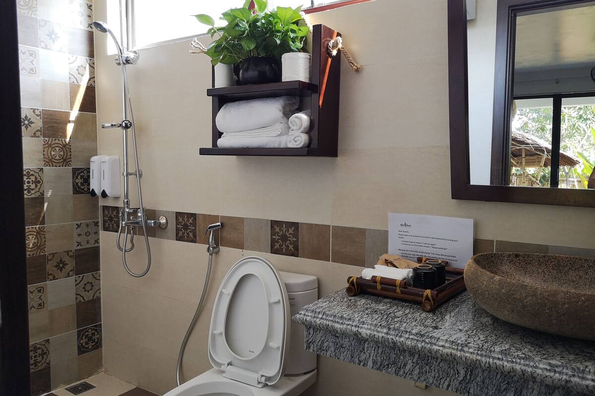 deep-soaking bathtub, rainfall showerhead, hair dryer, bathrobes