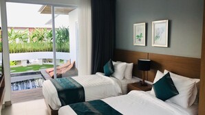 A hotel room with two beds, a large window, and a view of a garden. - Villa Ommy Hideway Residence No.108 (Ungasan)